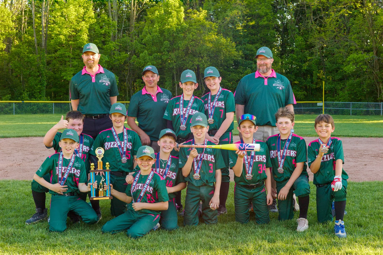 The Rizzlers team and coaches with their tournament trophies