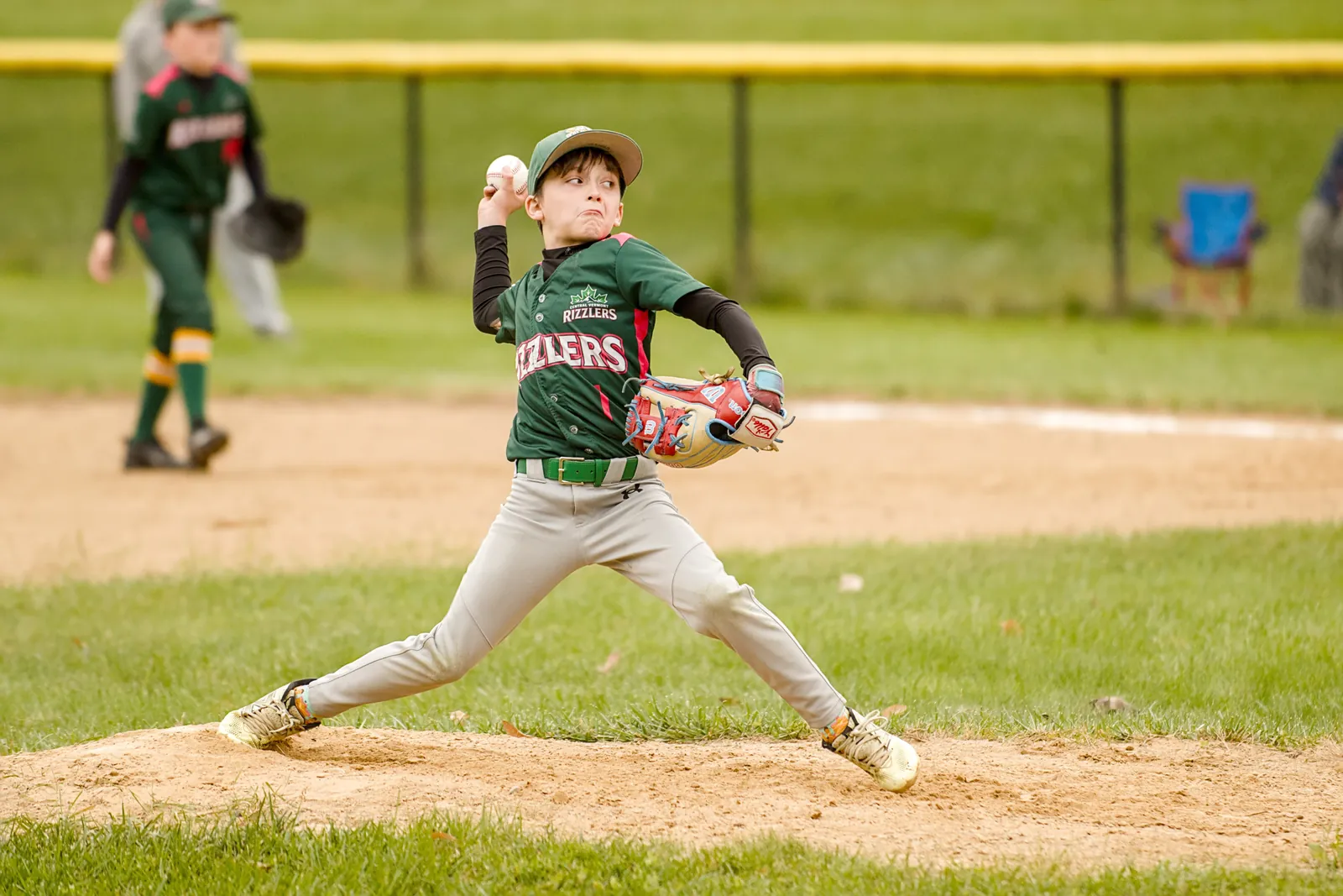 A Rizzlers pitcher delivers a pitch