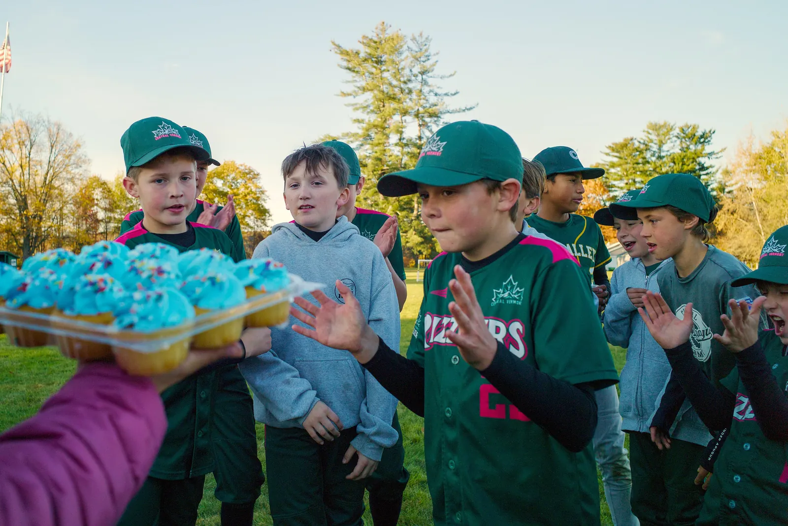 Rizzlers players sharing cupcakes after a game