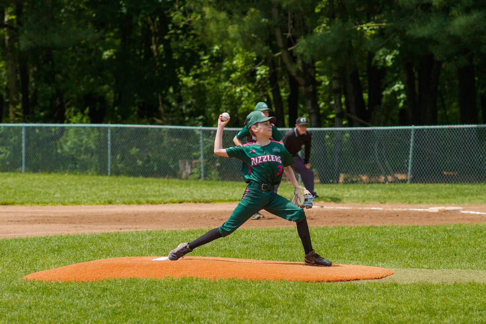 A Rizzlers pitcher strides toward the plate