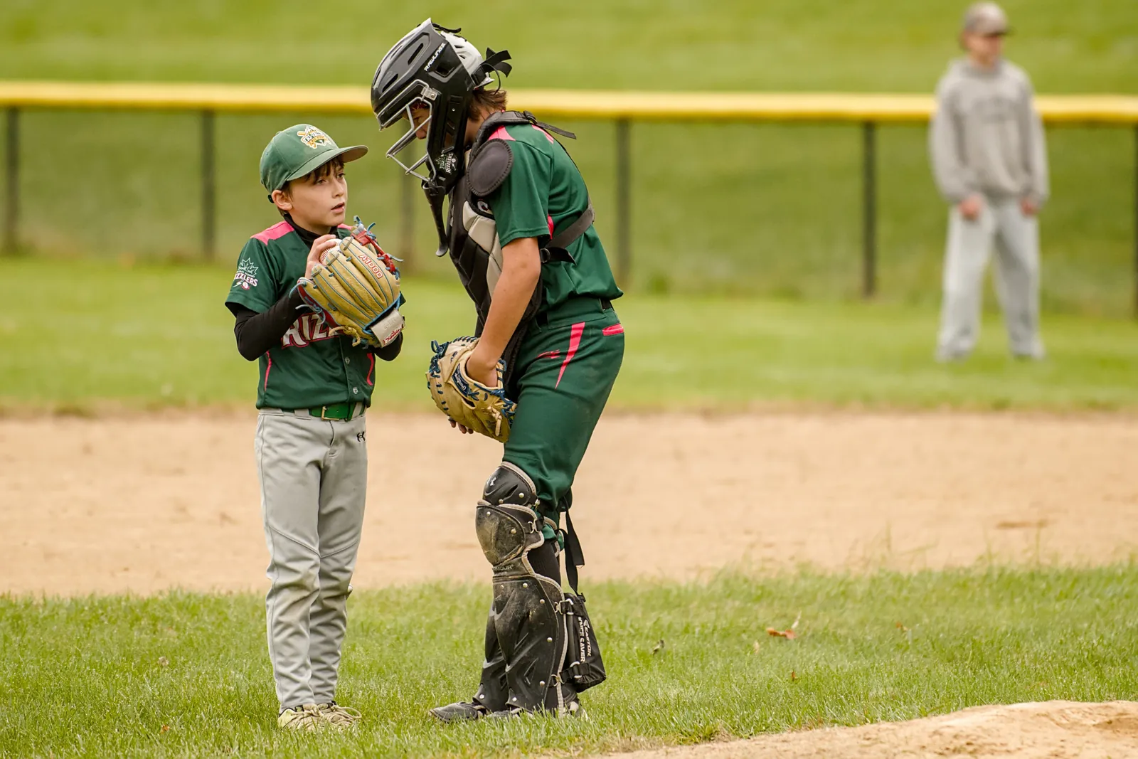 The Rizzlers pitcher and catcher talk on the mound