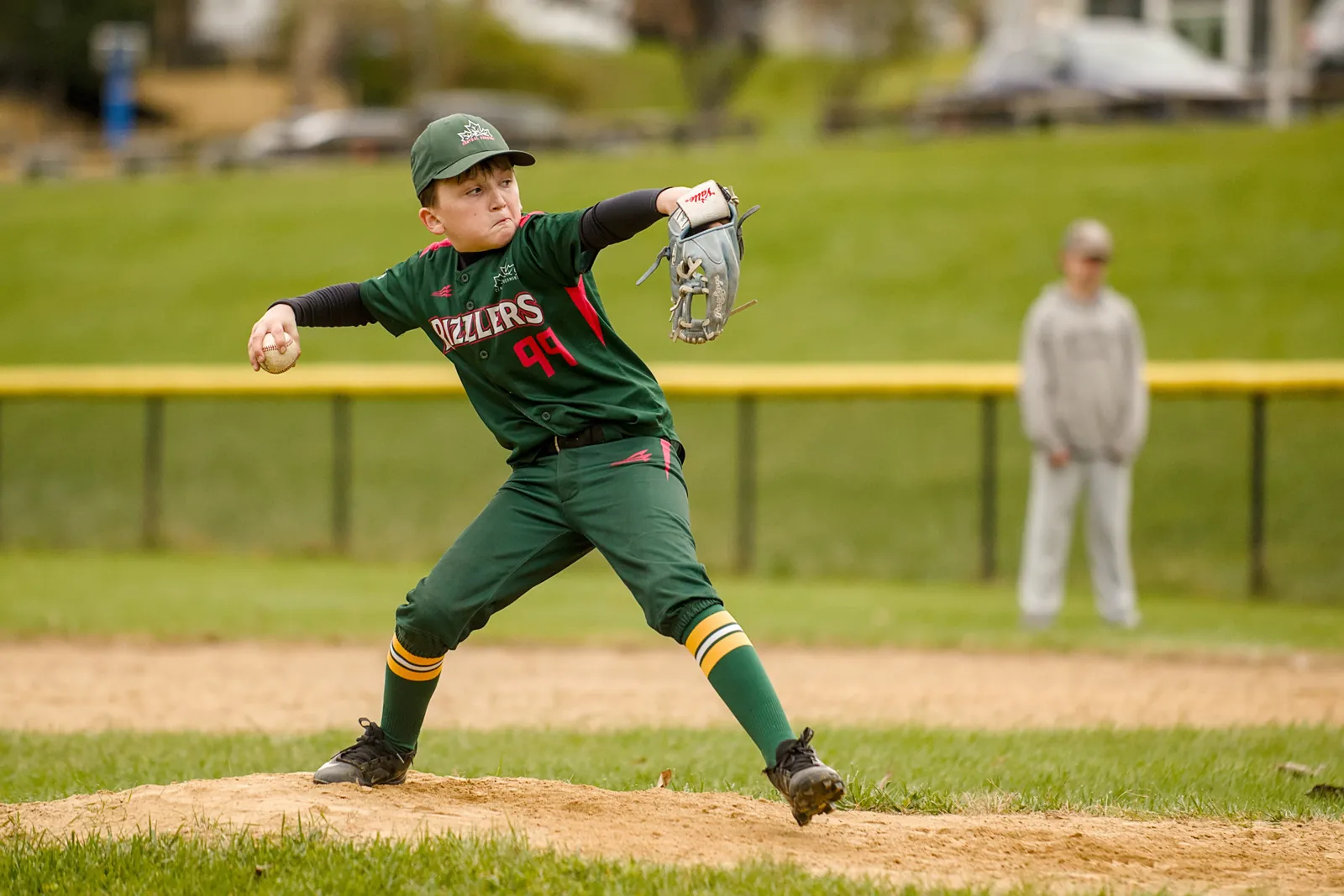 A Rizzlers pitcher delivers a pitch